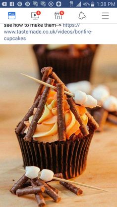 several cupcakes with sticks sticking out of them