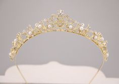 "Bridal Headpiece Rose Gold, Wedding Tiara for Brides, Pearl Wedding Tiara, Wedding Headpiece, Rose Gold Tiara This elegant and sparkle rhinestone Tiaras is perfect for your wedding or formal night out. This Tiaras is flexible. It will be perfect for the bride. The Metal Headband measured approx. 14\" long. The rhinestone part of the headband is about 9\" long and the center is 1.25\" high. Tone color: Silver tone, Gold tone and Rose gold tone. Pearl color : Swarovski white pearl and Ivory pearl Bridal Gold Tiara, Small Gold Tiara, Gold Pearl Tiara, Simple Gold Tiara, Wedding Tiara Gold, Quince Tiaras Gold, Gold Wedding Headband, Gold Crown Headband, Gold Bridal Tiara