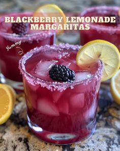 blackberry lemonade margaritas are garnished with blackberries