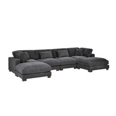 a large gray sectional couch with pillows on the top and bottom end, in front of a white background