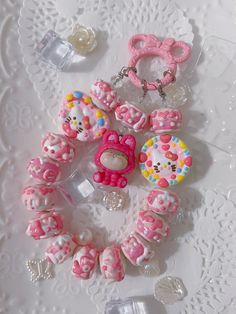 hello kitty keychains and charms on a doily