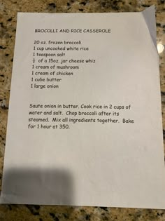 a piece of paper with instructions on it sitting on a counter top next to a cup of coffee