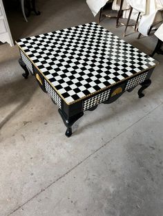 a black and white checkered coffee table with wheels