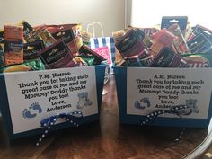 two baskets filled with candy and snacks on top of a table