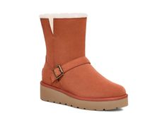 PRICES MAY VARY. Suede upper with medial zipper Decorative suede strap and buckle Faux fur lining and sockliner EVA outsole 1.75" wedge height Koolaburra By Ugg, Short Boot, Kids Luggage, Luxury Store, Short Boots, Womens Uggs, Special Features, Faux Fur, Wedges