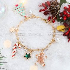 Good tidings of joy and cheer! Adorn your wrist with this festive Christmas Tree Gingerbread Man Bracelet! It's the perfect festive accessory to add the extra kick of cheer to your winter outfits! It's sure to be a hit at any holiday gathering! Ho-ho-ho! DETAILS Plating: 18K Gold Materials: 18K Gold on Brass, Dripping oil,  Imitation Pearl, Zircon Measurements: Length:  3.15 "(8.0cm)  + Extender: 1.57"(4.0cm) Weight: 15g Christmas Holiday Bracelet Jewelry, Christmas Holiday Jewelry Bracelet, Christmas Gift Bracelet Jewelry, Gold Christmas Party Bracelets, Holiday Festive Jewelry Bracelet, Festive Bangle Bracelets As Gifts, Gold Bracelets As Christmas Gifts, Gold Bracelets For Christmas Gift, Christmas Party Beaded Bracelets