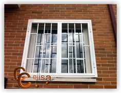 the word cisa is written in front of a brick building with an open window