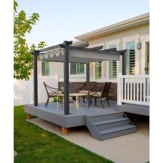 an outdoor patio with steps leading up to the deck