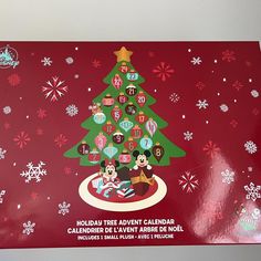 a christmas tree with mickey and minnie mouses around it on a red background that reads holiday tree adventure calendar