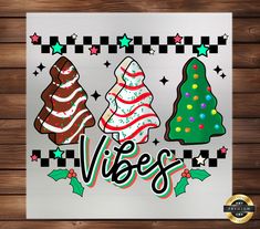 three christmas trees with the word vegas on them, surrounded by holly and stars