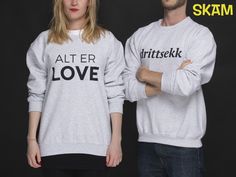 two people wearing sweaters with the words alter love written on them, standing in front of a black background