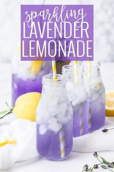 three mason jars filled with lemonade and ice on top of a white tablecloth