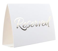 a white card with the word reserved on it