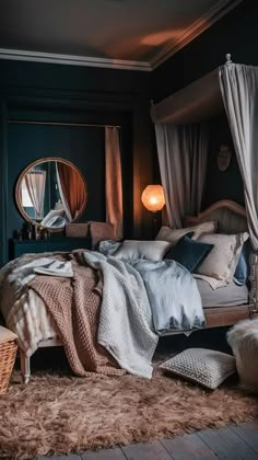 a bedroom with a large bed and lots of pillows on the floor next to it