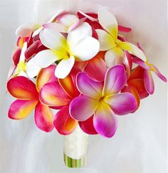 a bouquet of colorful flowers in a white vase