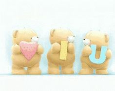 three teddy bears holding letters that spell out the word u and one with a heart