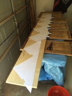 the table is being made with plywood and scissors