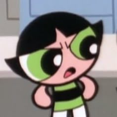 an animated character with green eyes and black hair