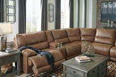 a living room filled with furniture and windows