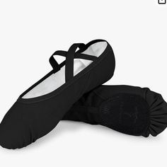 pair of black ballet shoes on white background