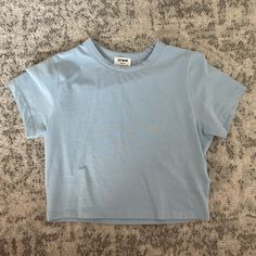 Never Worn - In Perfect Condition! Basic Light Wash Cotton Tops, Blue Crew Neck Crop Top, Blue Fitted Cropped T-shirt With Crew Neck, Trendy Light Blue Crew Neck Crop Top, Blue Fitted Crew Neck Cropped T-shirt, Blue Casual Cropped T-shirt For Spring, Basic Blue Summer Tops, Basic Blue Tops For Spring, Basic Blue Tops For Summer