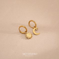 🏷 [DESCRIPTION] These stunning gold hoop earrings feature a celestial pairing of a crescent moon and a radiant sun charm. Made from lightweight, waterproof stainless steel, they're perfect for all-day comfort and durability.  💎[MATERIAL & MEASUREMENT] - 1 Pair - Stainless Steel - Tarnish-Resistant - Nickel & lead-free - Waterproof Boho Hoop Earrings, Sun Charm, Gold Sun, Moon Earrings, Dangle Charms, Jewelry Earrings Hoops, Gold Hoop, Gold Hoop Earrings, Charm Earrings