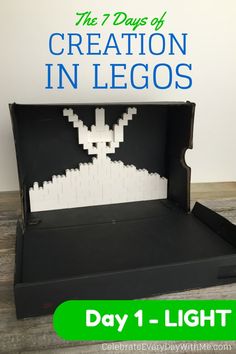 an open cardboard box with the words creation in legos on it and a white rabbit inside