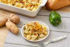 potatoes, green peppers and other vegetables are on the table next to casserole