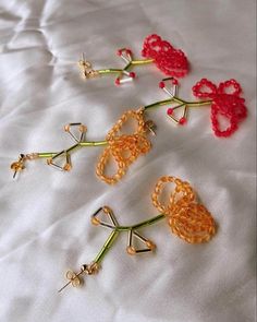 Handmade beaded Flower single drop earrings in 2 colours chrysanthemum and red . Red Beaded Flower Shaped Jewelry, Orange Beaded Flower Earrings, Elegant Flower Earrings With Colorful Beads, Orange Flower Earrings With Colorful Beads For Gift, Unique Red Flower Earrings, Elegant Orange Flower Earrings For Gift, Red Flower Dangle Earrings With Colorful Beads, Unique Colorful Beaded Flower Earrings Gift, Red Dangle Flower Earrings With Colorful Beads