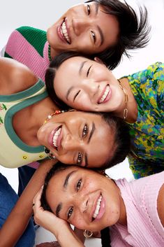 four people are smiling and posing for the camera