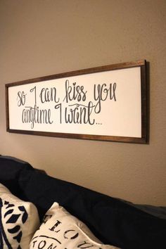 a wooden sign that says so i can kiss you anytime i want it on the wall