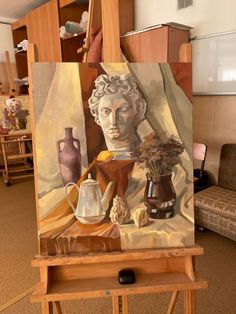 an artist's easel with a painting on it