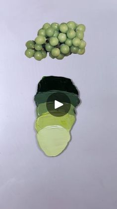 an image of grapes being sliced and put in the shape of a man's face