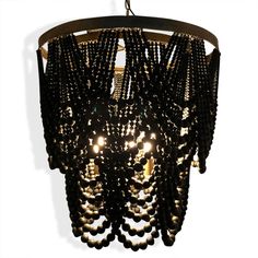 a black chandelier with beads hanging from it