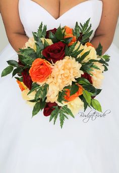 a woman in a white wedding dress holding a bridal bouquet with orange and red flowers