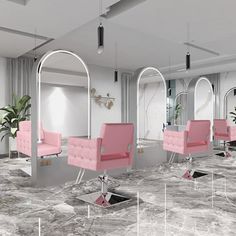 a room filled with pink chairs and mirrors