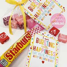 valentine's day cards, candy and candies are laid out on a table