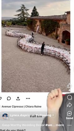 a person taking a photo with their cell phone in front of a table set up