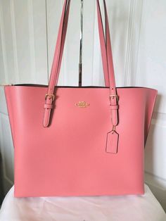 NWOT COACH MOLLIE TAFFY PINK LEATHER LARGE TOTE  SHOULDER BAG HANDBAG SATCHEL $378. Pebble leather Inside multifunction pocket Zip-top closure, fabric lining Handles with 10 1/4" drop Side open compartments 13 1/4" (L) x 11" (H) x 5" (W) Style No. 1671 New without Tags!!! Luxury Pink Bags With Leather Handles, Pink Soft Leather Tote Bag, Designer Pink Satchel For Office, Pink Coach Bag With Zipper Closure, Luxury Pink Tote Shoulder Bag, Luxury Pink Shoulder Bag With Leather Handles, Classic Pink Bag For Everyday Use, Pink Soft Leather Tote Satchel, Classic Pink Leather Bag