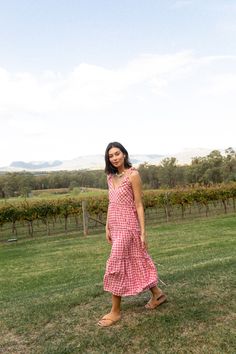 Feel alive in the airy Viviana; a multiway midi dress to stand the test of time and complete your capsule wardrobe. Dainty yet playful, alluring yet striking. A pink gingham staple piece taking your sun dress to new heights with its multifunctional and practical design and fun, feminine print. Sway into any occasion with considered lightweight fabric made for the warmer temperature or team with boots and a light-weight knit for the cooler seasons. Thoughtfully crafted to be customisable and worn Postpartum Tummy, Multiway Dress, Australian Swimwear, Multi Way Dress, Reversible Bikinis, Practical Design, Pink Gingham, Pink Maxi Dress, Gingham Print