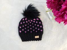 "This sweet little toque is perfect for your little one to keep warm while looking oh so very adorable! Or perfect as gift for that special girl in your life -niece,grandchild-you named it. Details: -Seamless hand knit chunky beanie -Incredibly warm and comfortable made with a high quality, soft, chunky wool/acrylic blend yarn -Perfect winter accessory This hat is part of my new session: ONE OF A KIND HAT. I am only have the same pink material to make 0ne more hat,that's it. It is READY to SHIP& Knit Chunky Beanie, Hand Knitted Black Acrylic Hat, Playful Pink Hand Knitted Hat, Pink Knitted Acrylic Hat, Black Hand-knitted Acrylic Hat, Pink Hand-knitted Crochet Beanie Hat, Hat With Pom Pom, Chunky Beanie, Chunky Wool