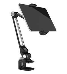 an image of a tablet mounted on a desk with a phone holder attached to it