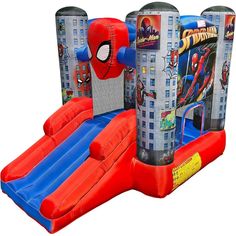 an inflatable spiderman bounce house with slide