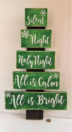 a christmas tree made out of wooden signs