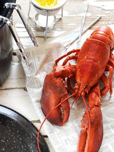 there is a cooked lobster on the table