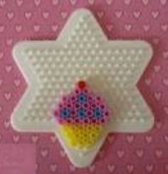 an ornament made to look like a cupcake with sprinkles