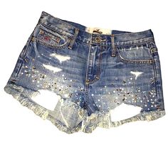 Size 00 Hollister Shorts Are New Without Tags These Were Difficult To Photograph And Do Not Show How Pretty The Rhinestone Detailing Is. Model Is 5’3 110 Lbs High Rise Denim Bottoms With Rhinestones, Casual Medium Wash Rhinestones Bottoms, Summer Denim Bottoms With Rhinestones, Spring Bottoms With Rhinestones In Medium Wash, Summer Blue Bottoms With Rhinestones, Summer Blue Rhinestoned Bottoms, Blue Rhinestone Bottoms For Summer, Summer Blue Rhinestone Bottoms, Blue Denim Jean Shorts With Rhinestones