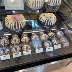 a display case filled with lots of cakes