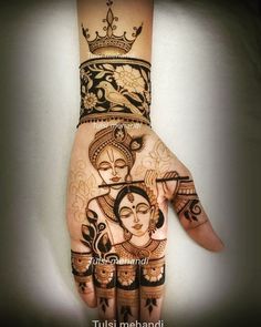 the hand is decorated with henna designs