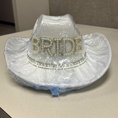 a plastic hat with the word bride written on it